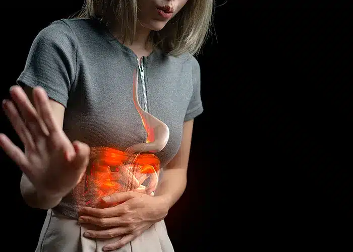 Women touching gut gut health and stress nutrition